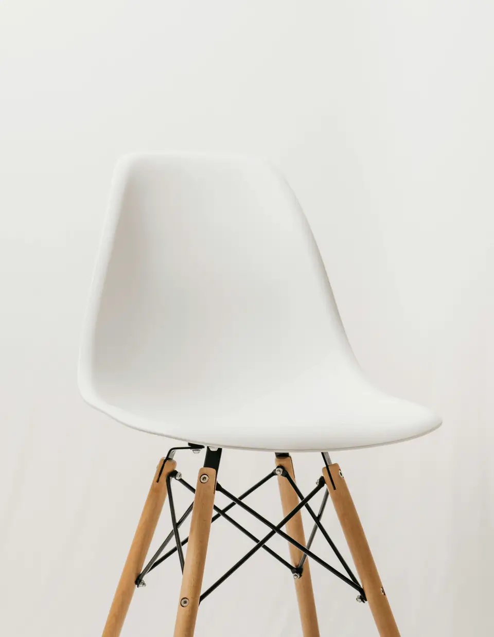 White chair with a wooden frame
